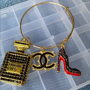 Gold plated bangle with charms